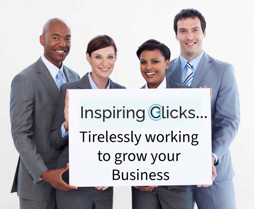 Team of professionals holding up a sign that reads: "InspiringClicks... Tirelessly working to grow your business."