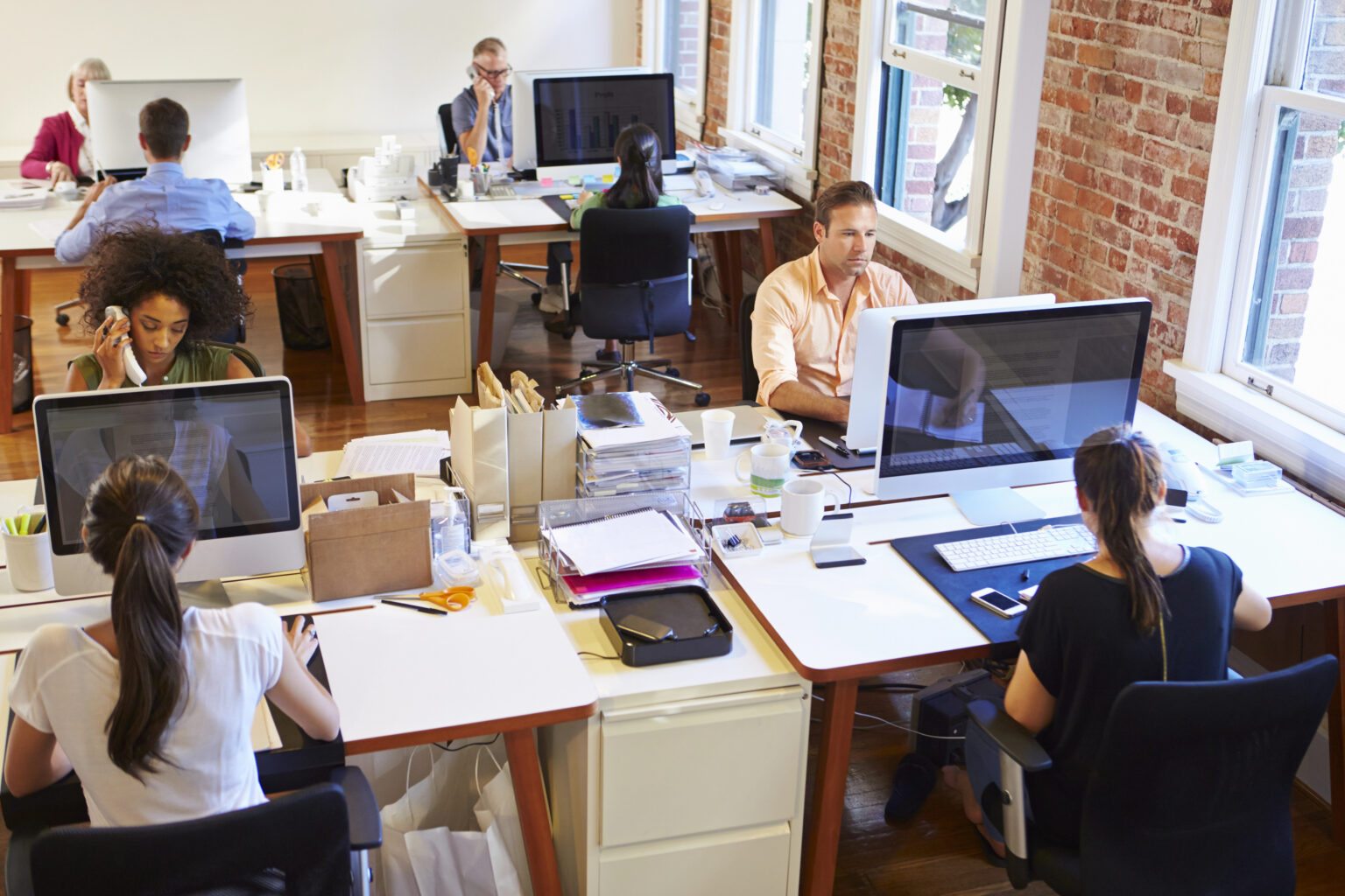 Team of designers and developers collaborating on custom web assets