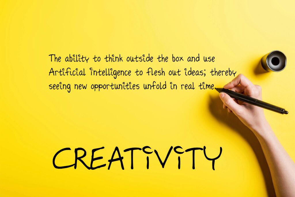 Hand writing the definition of creativity on a yellow background, highlighting the use of artificial intelligence to generate new ideas in real time