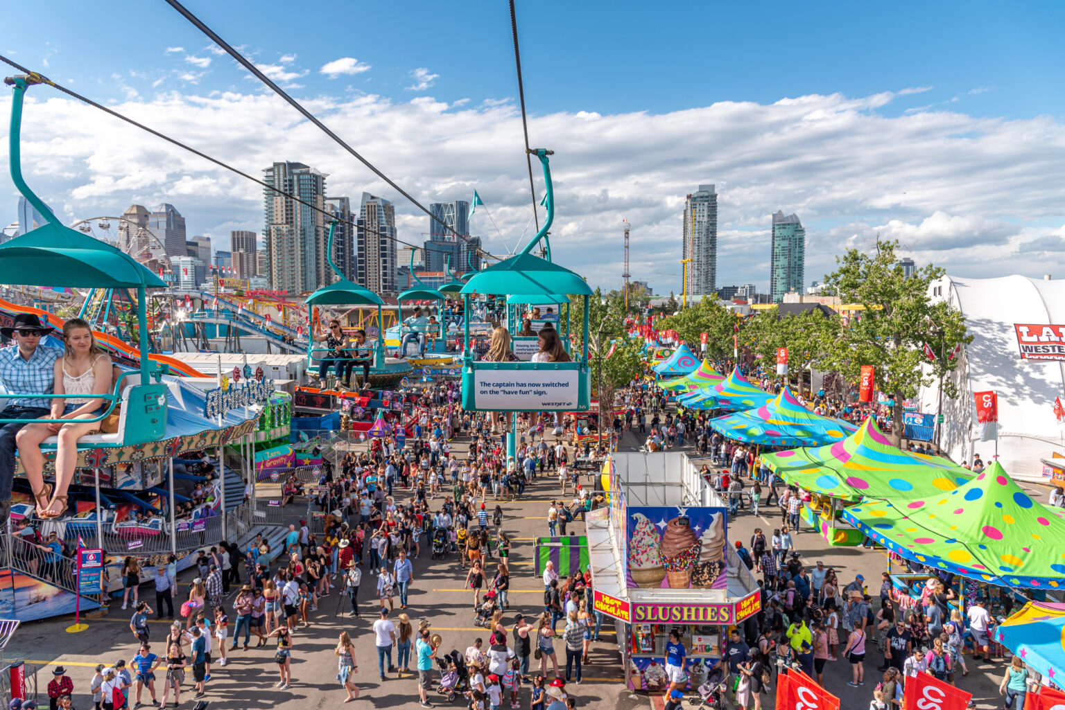 Calgary Stampede grounds with iconic structures and blue sky