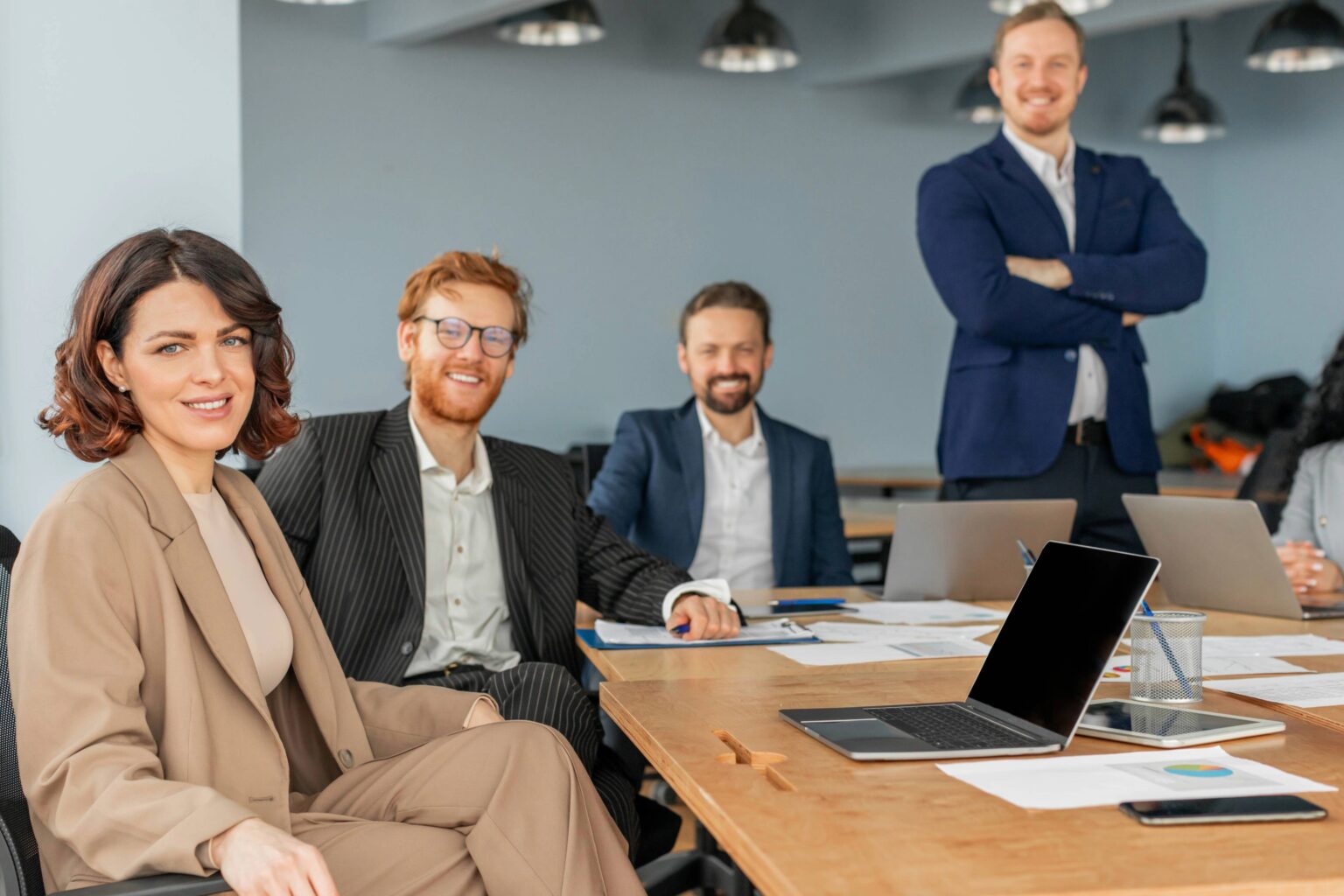 The InspiringClicks team collaborating around a conference table in a modern office