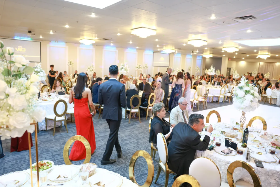 Guests mingling at a formal reception event inside Heritage Banquet Hall with elegant decor