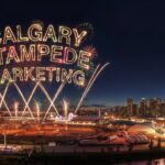Calgary Stampede fireworks above the Stampede grounds with the words “Calgary Stampede Marketing” glowing in the night sky over downtown Calgary.