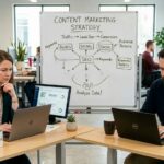 Two people sitting in office thinking of ways to overcome content marketing challenges